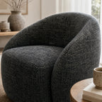 Ingrid Swivel Chair Basalt with textured poly-mix upholstery, curved silhouette and plush cushioning.
