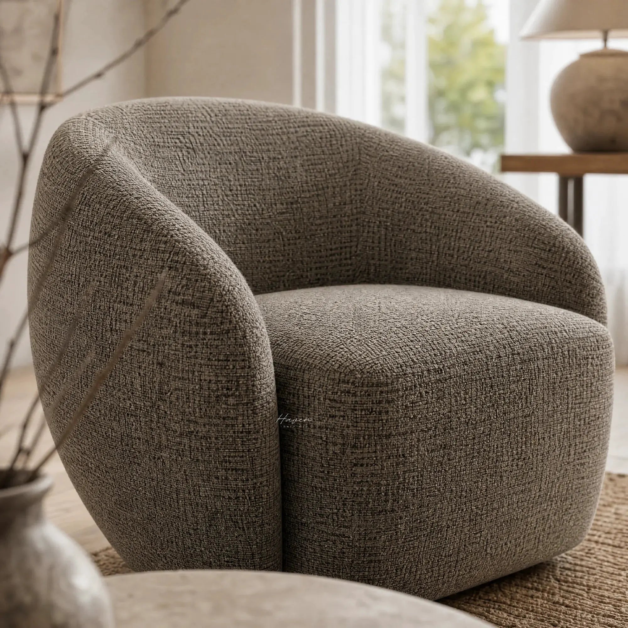 Ingrid Swivel Chair - Tundra fabric with textured poly-mix upholstery and soft curved silhouette