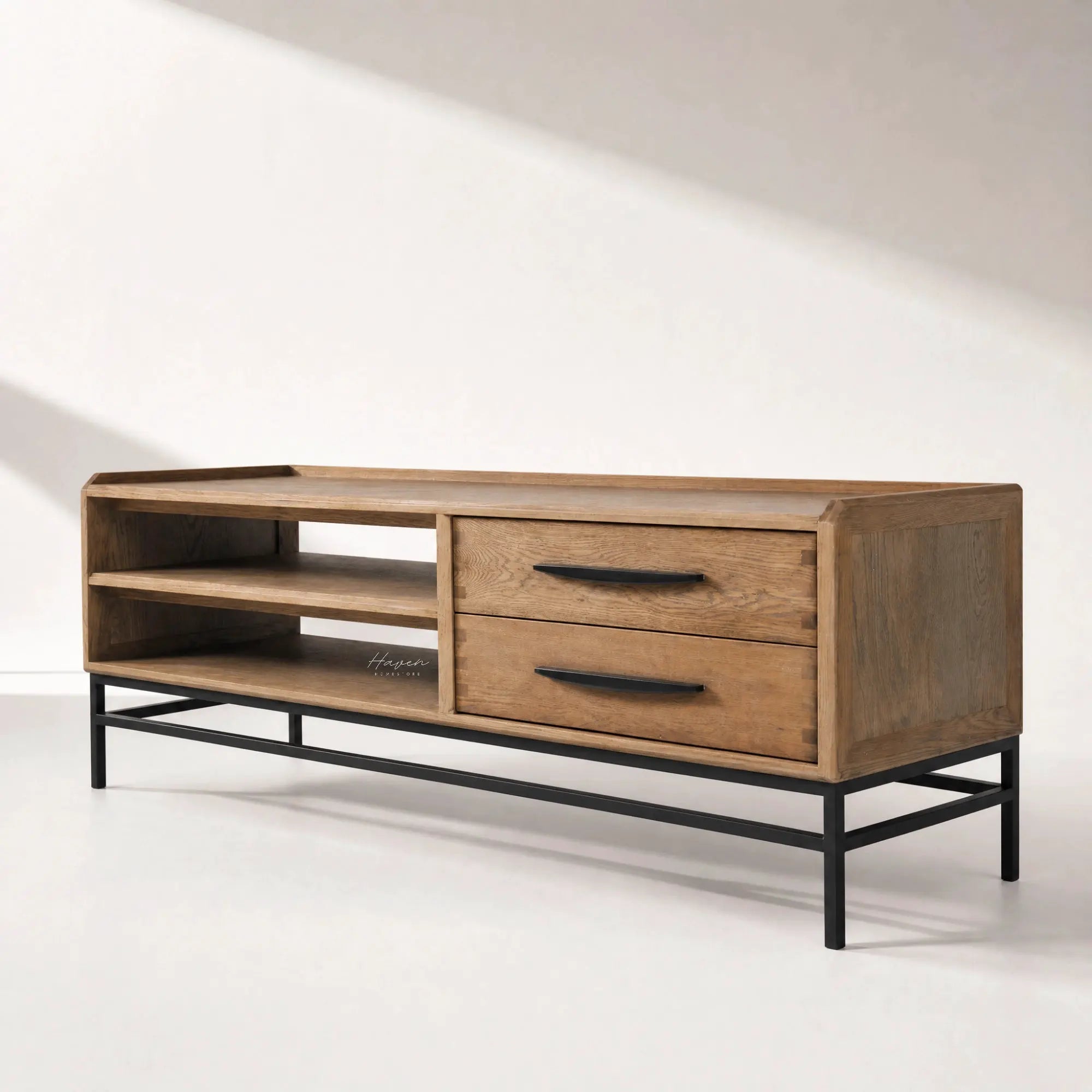 Atlas Entertainment Unit in natural oak with metal detailing, open shelves and two drawers on a black metal base.