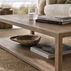 Driftwood Coffee Table in ash wood with open lower shelf, coastal living room.