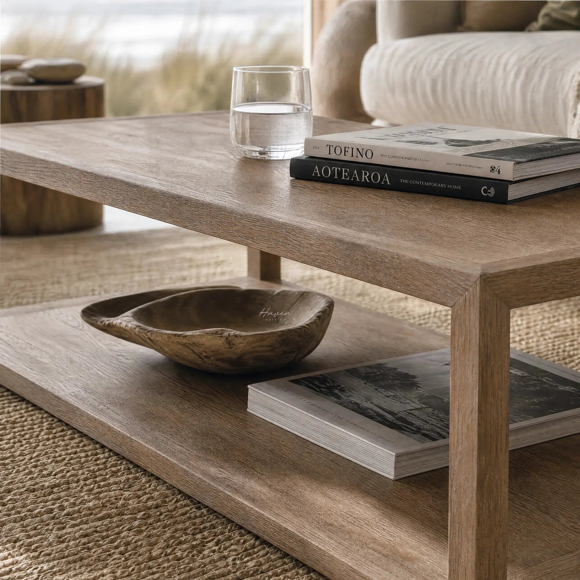 Driftwood Coffee Table in ash wood with open lower shelf, coastal living room.