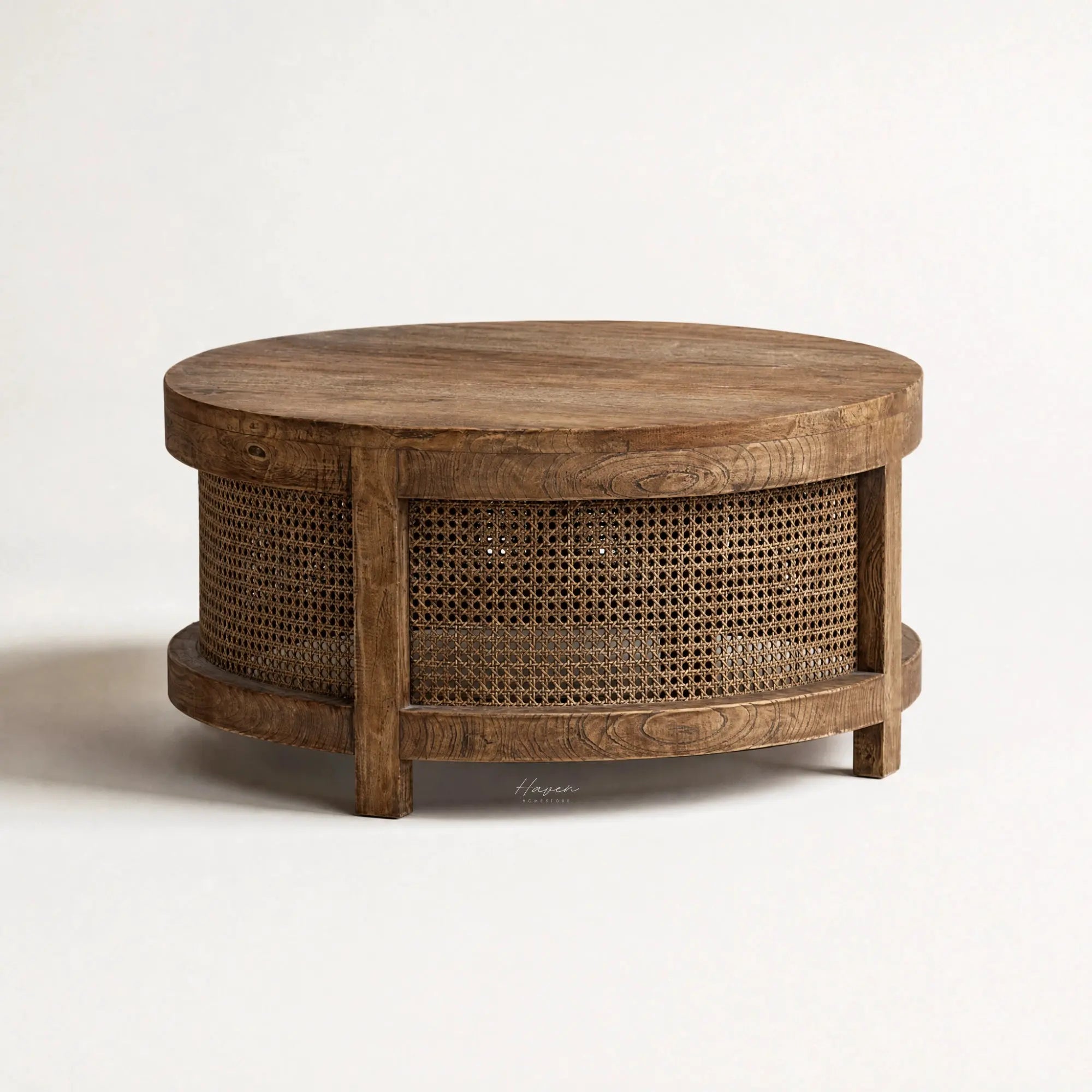 Ubud Coffee Table with a round bleached-elm top and handwoven rattan sides.