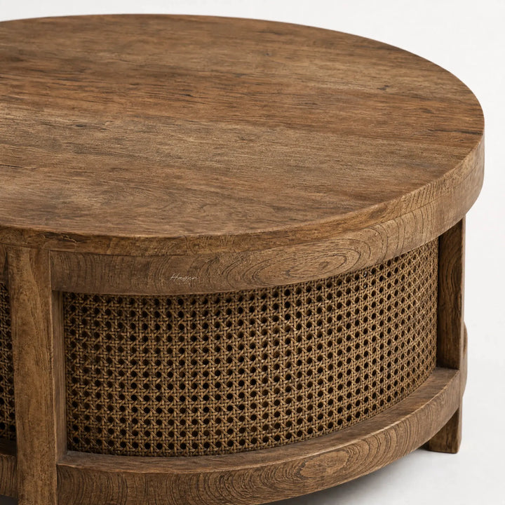 Ubud Coffee Table with a bleached elm top and handwoven rattan weave, warm round silhouette inviting conversation.
