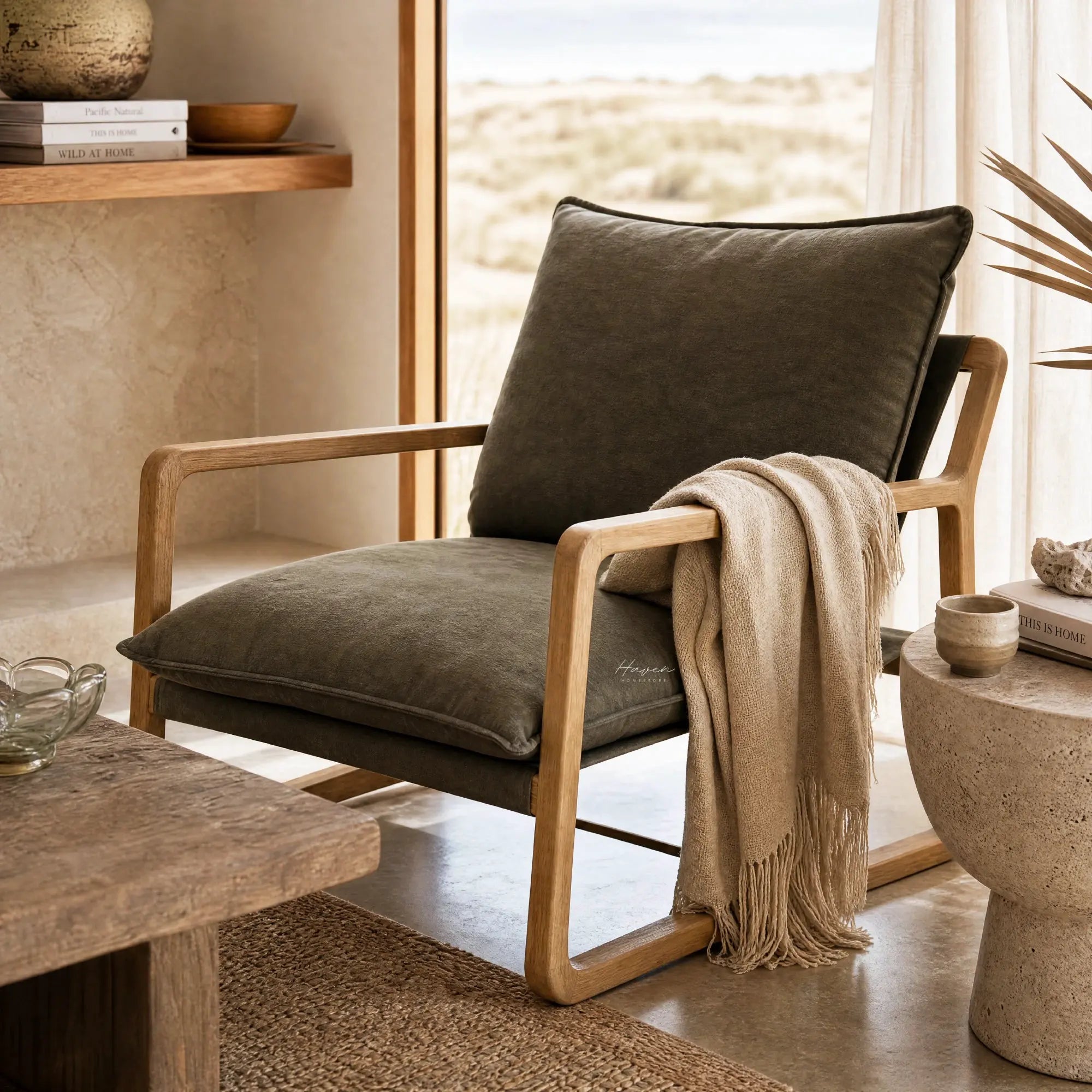 Tide Lounge Chair Flax: solid oak frame with soft stone-washed cushions in a sunlit coastal living room.