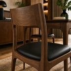 Ellison Dining Chair – Walnut finish with black leather upholstered seat, mid-century style.