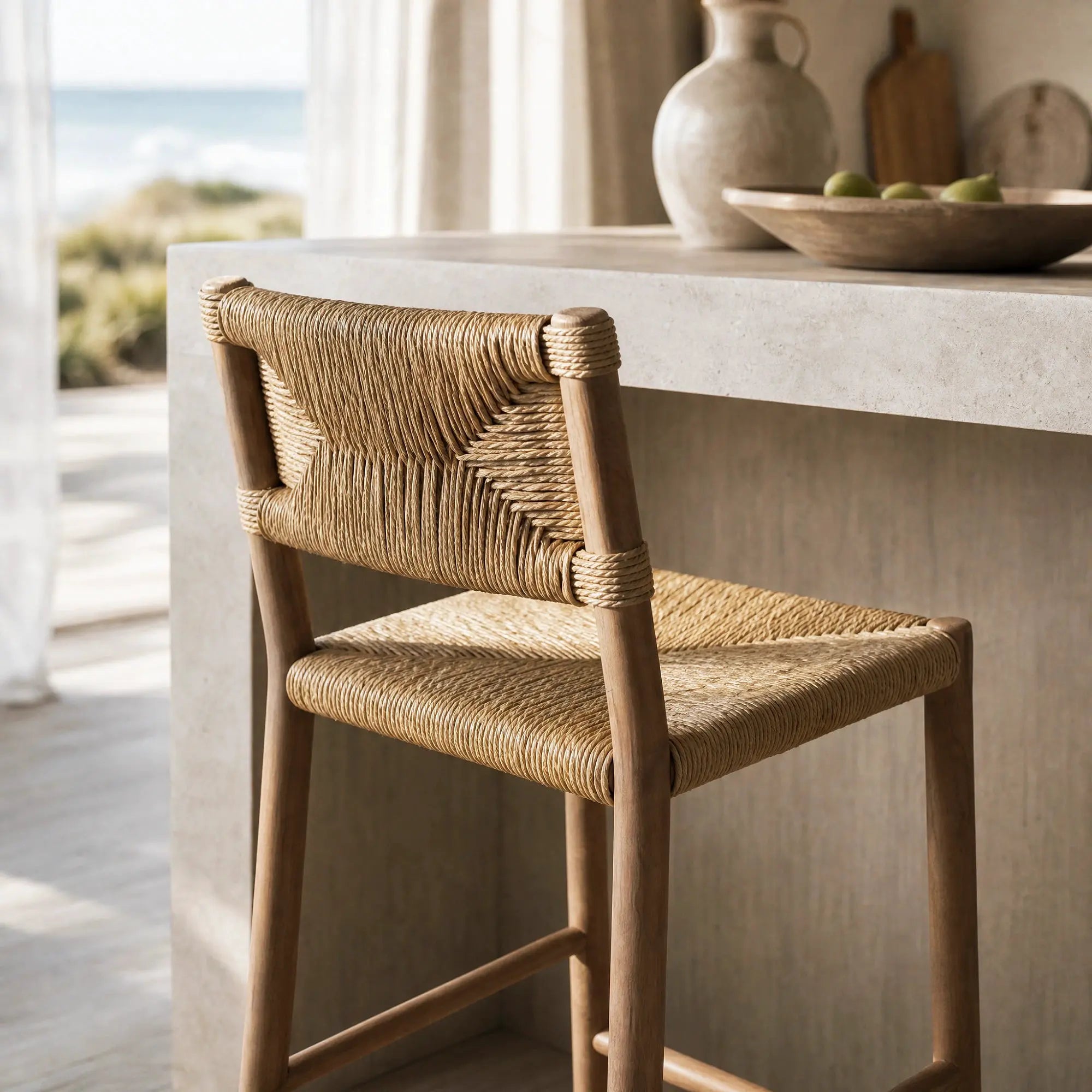 Drift Counter Stool with solid oak frame and handwoven seagrass seat/backrest, coastal warmth for kitchen or bar.