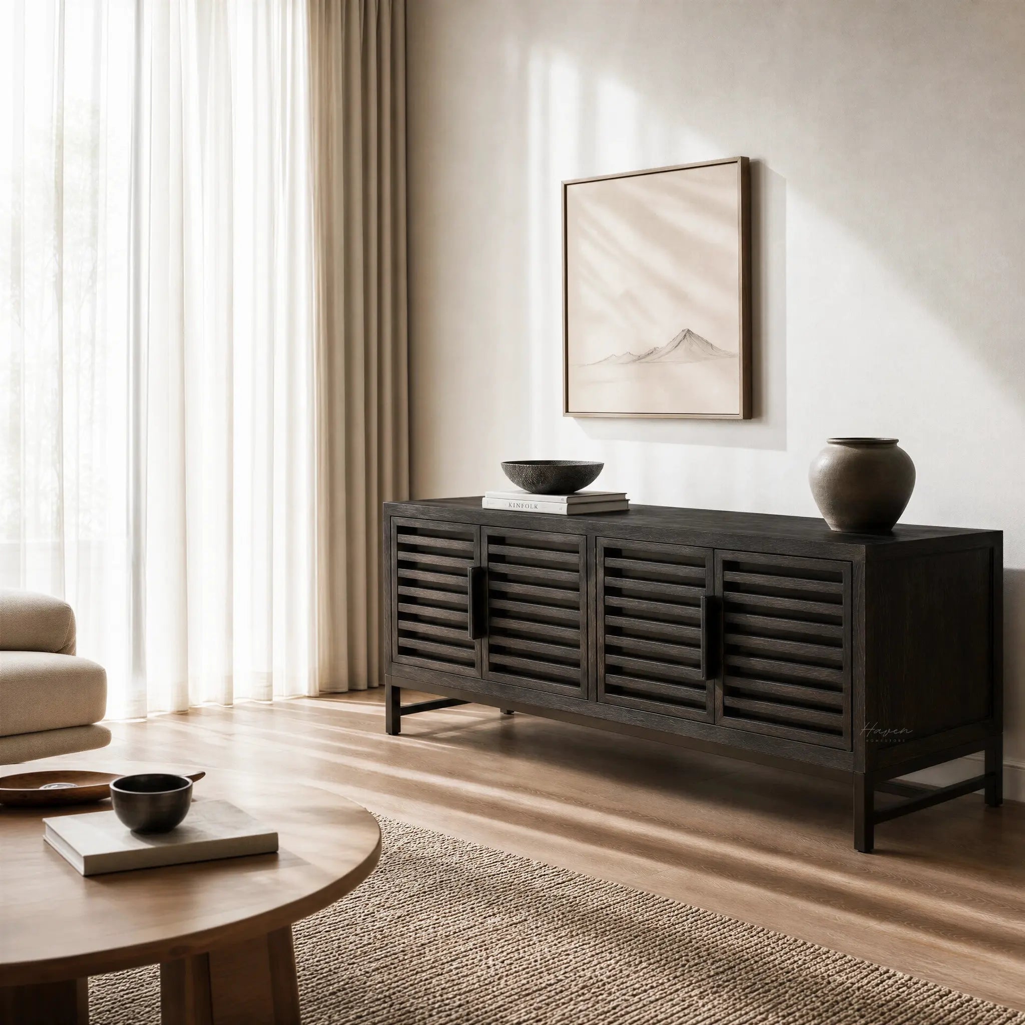 Kuro Slatted Sideboard in ebony-washed oak with slatted doors in a neutral, minimalist living room.