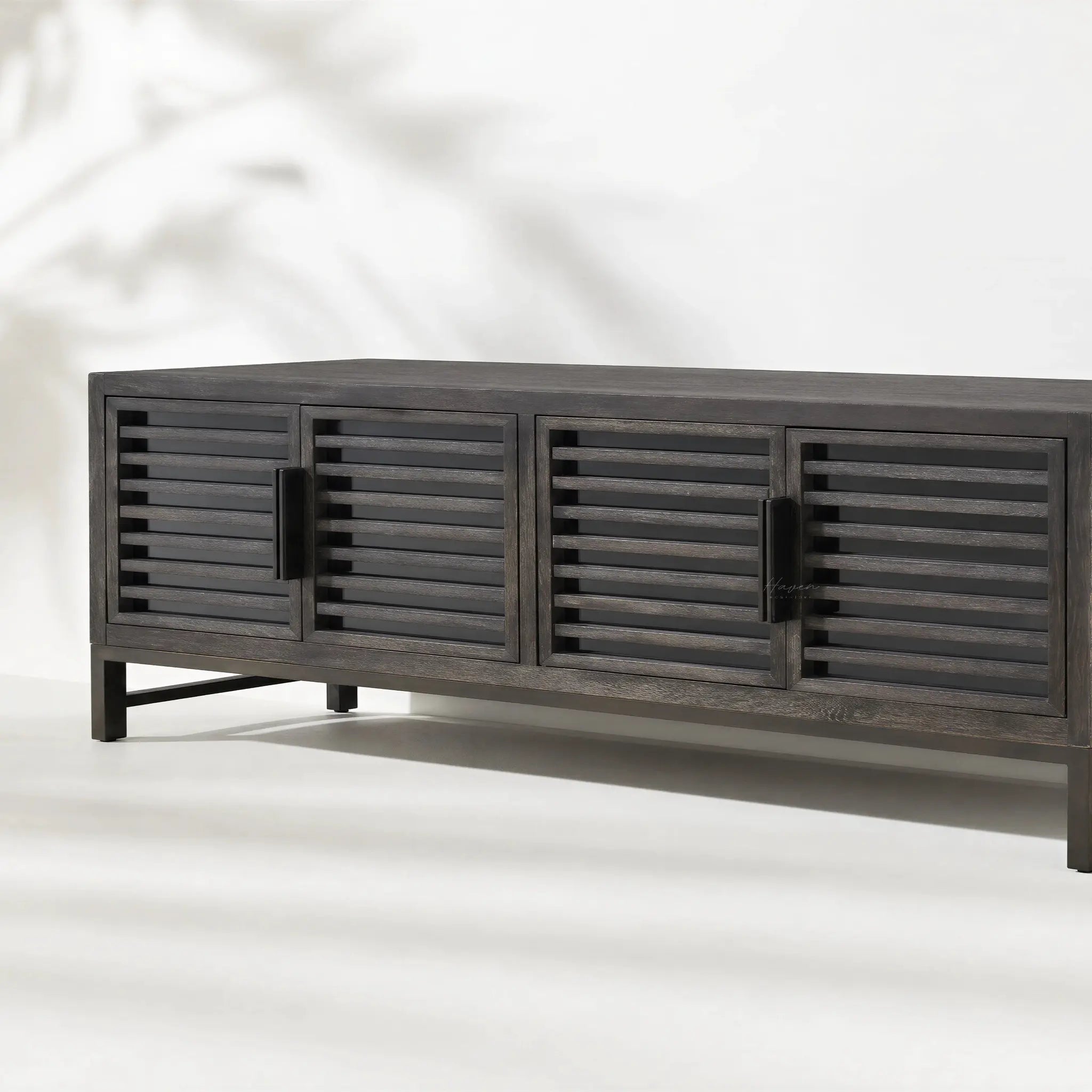 Kuro Slatted Sideboard in ebony-washed oak with architectural, framed design and slatted doors.