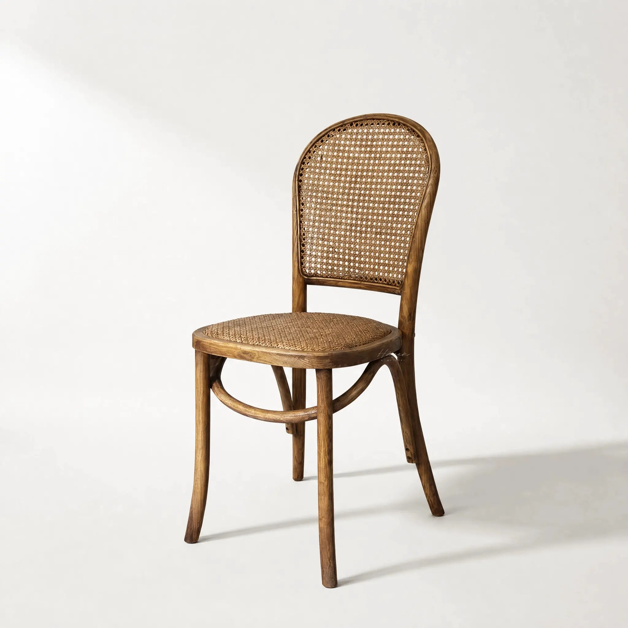 Margaux Dining Chair in oak with woven natural rattan seat and back.