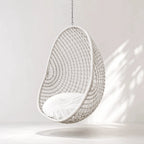 Check Pod Chair hanging wicker pod chair with chain suspension in white.