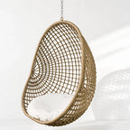 Check Pod Chair hanging wicker chair with white cushion and chain suspension