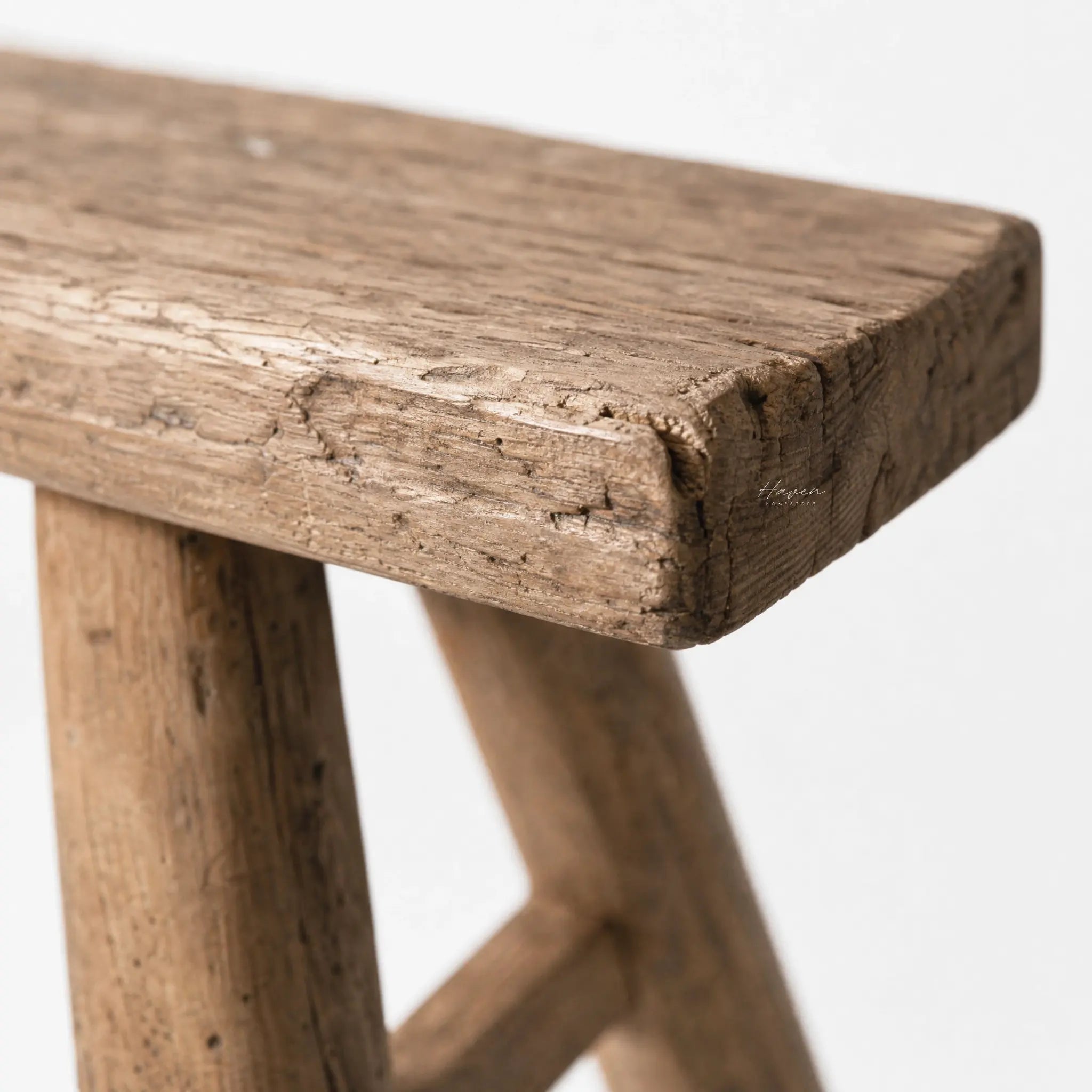 Workshop Elm Bench in solid elm with a timeworn finish; rustic, weathered grain and sturdy silhouette.