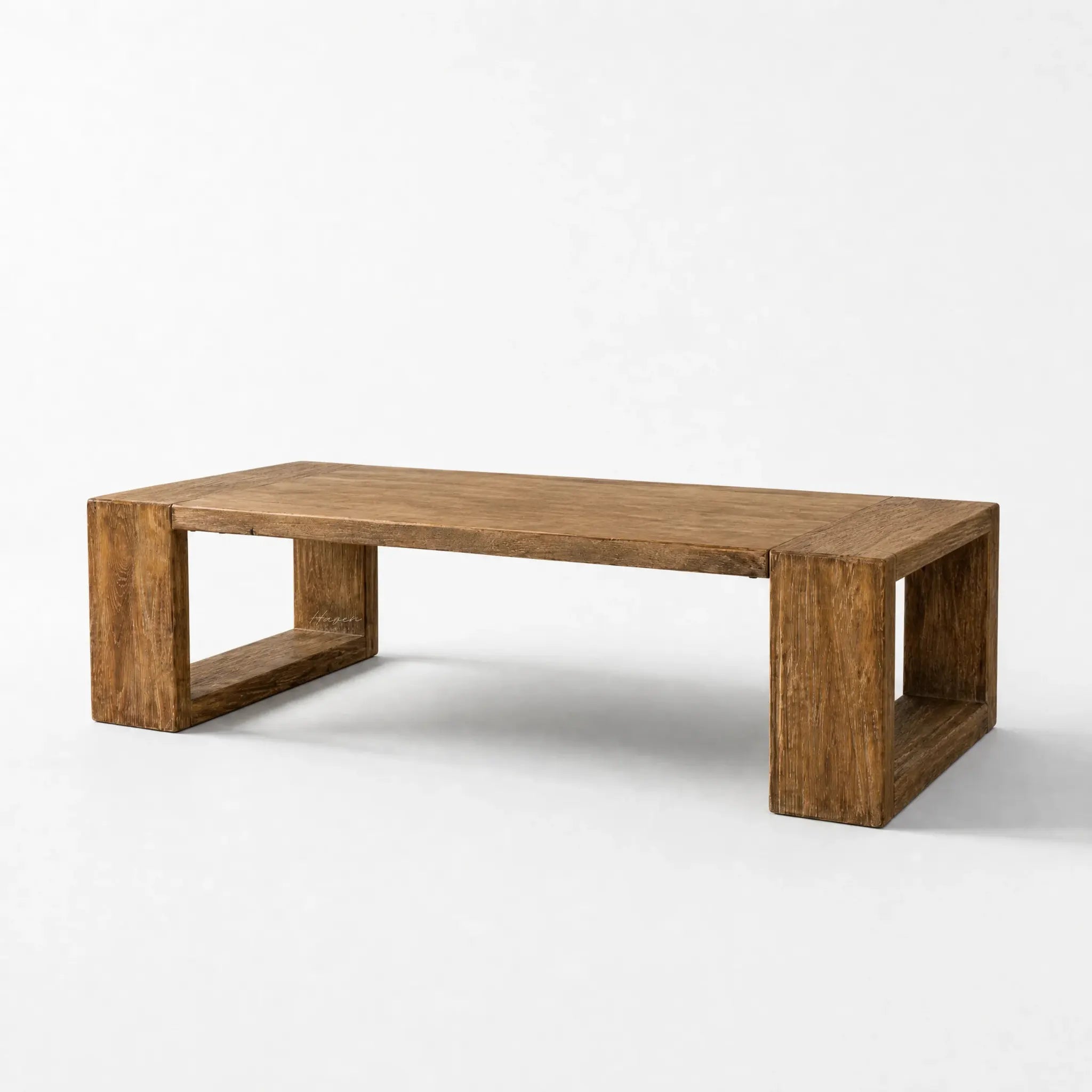 Casa Coffee Table in reclaimed elm wood with an aged black finish, bold rectangular legs and natural grain.