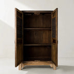 Nomad 2 Door Cabinet in weathered reclaimed pine with carved detailing and paneled doors.