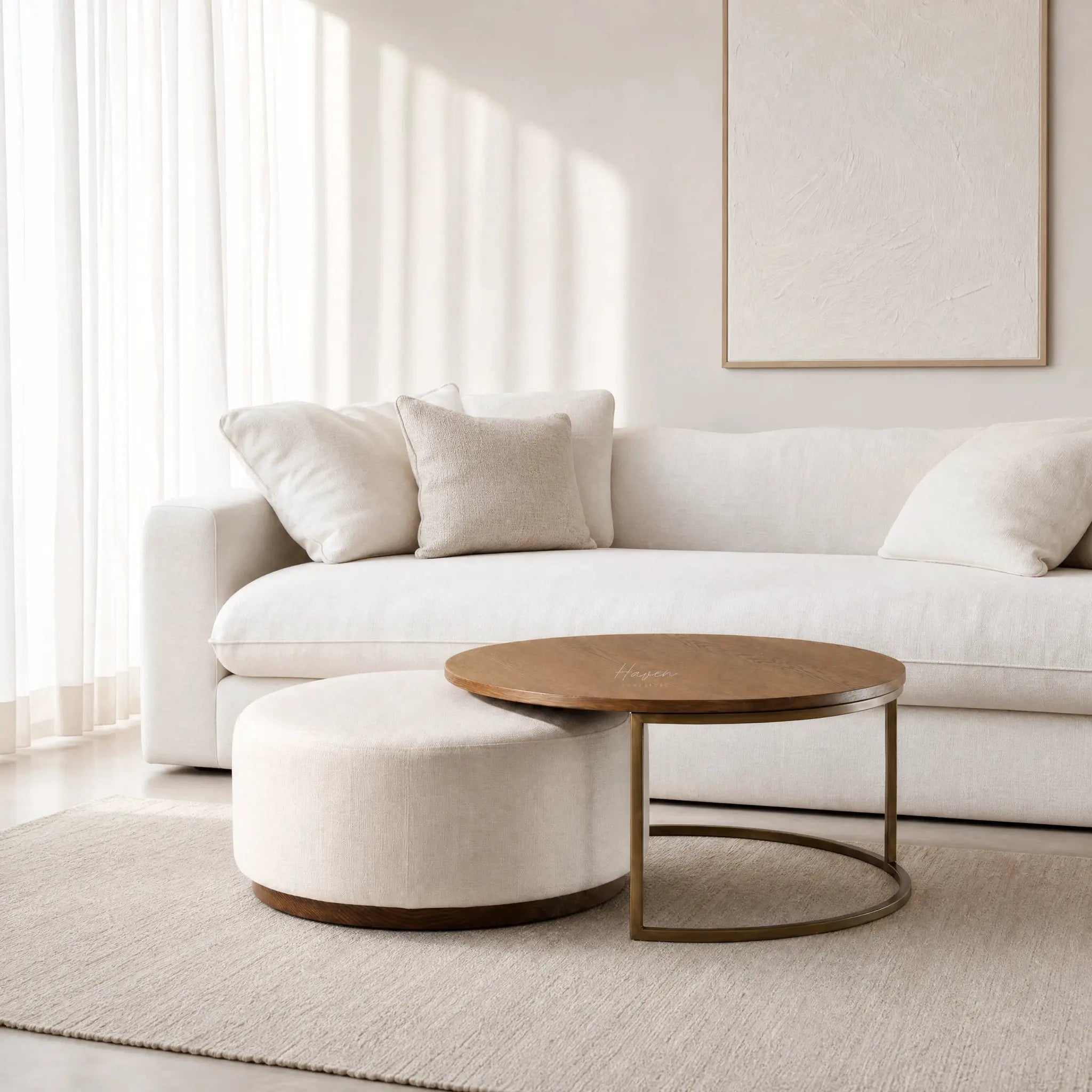 Eleanor Coffee Table + Ottoman with ashwood top and iron frame in a neutral living room.