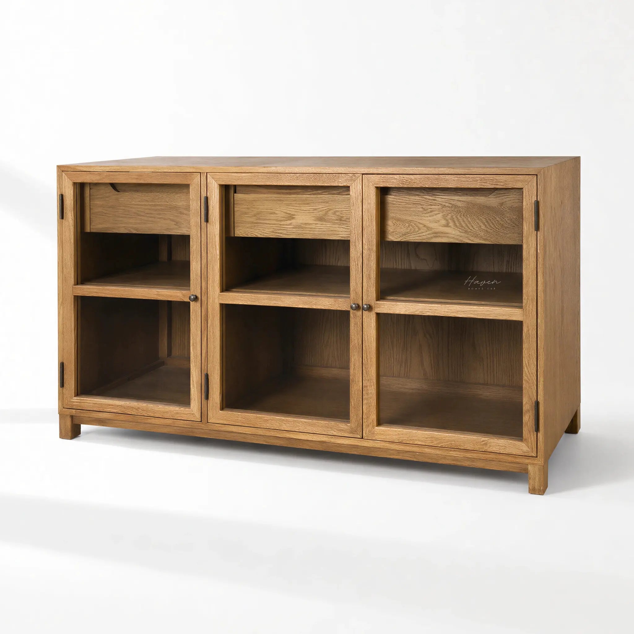 Baxter Oak Sideboard in warm oak veneer with glass-front doors and ample storage.