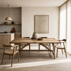 Briar Elm Dining Table in a warm rustic dining scene with reclaimed elm grain and simple chairs.