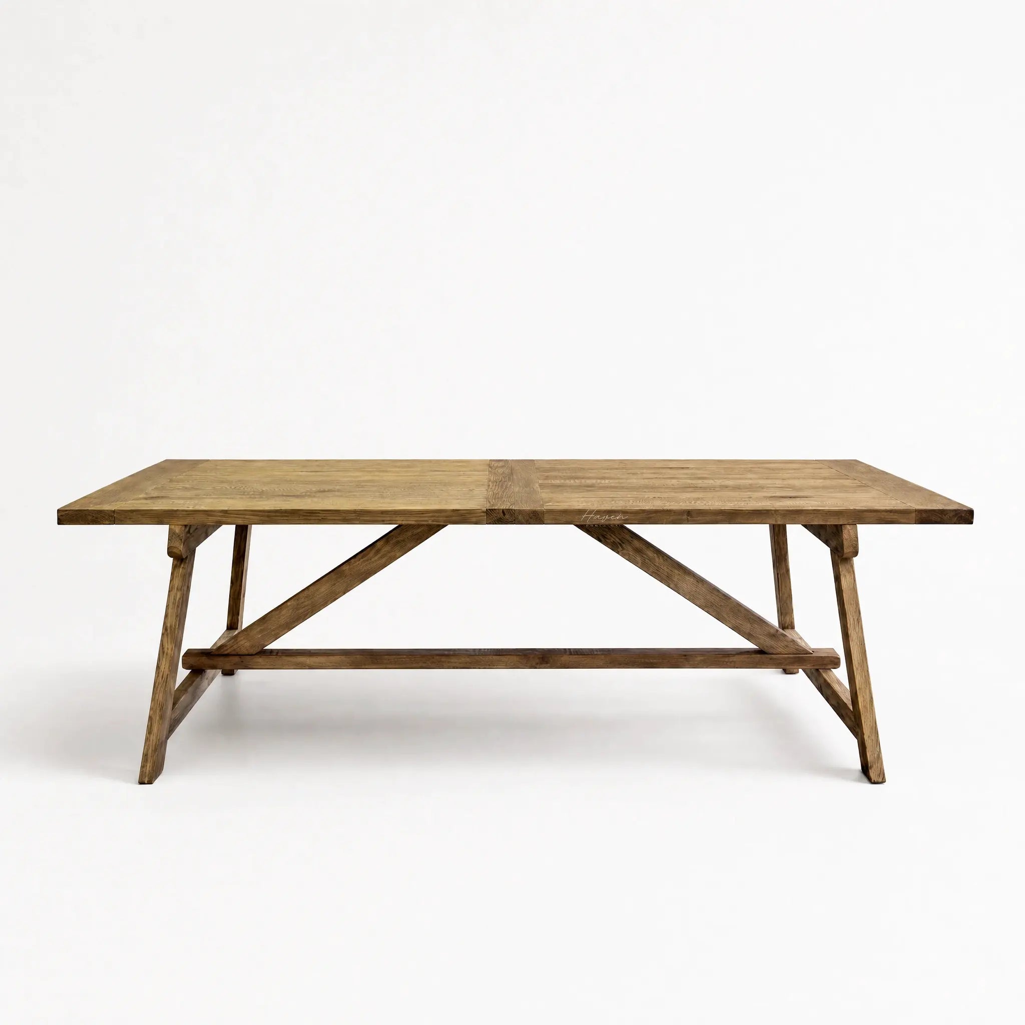 Briar Elm Dining Table in warm reclaimed elm with farmhouse charm and X-frame supports.