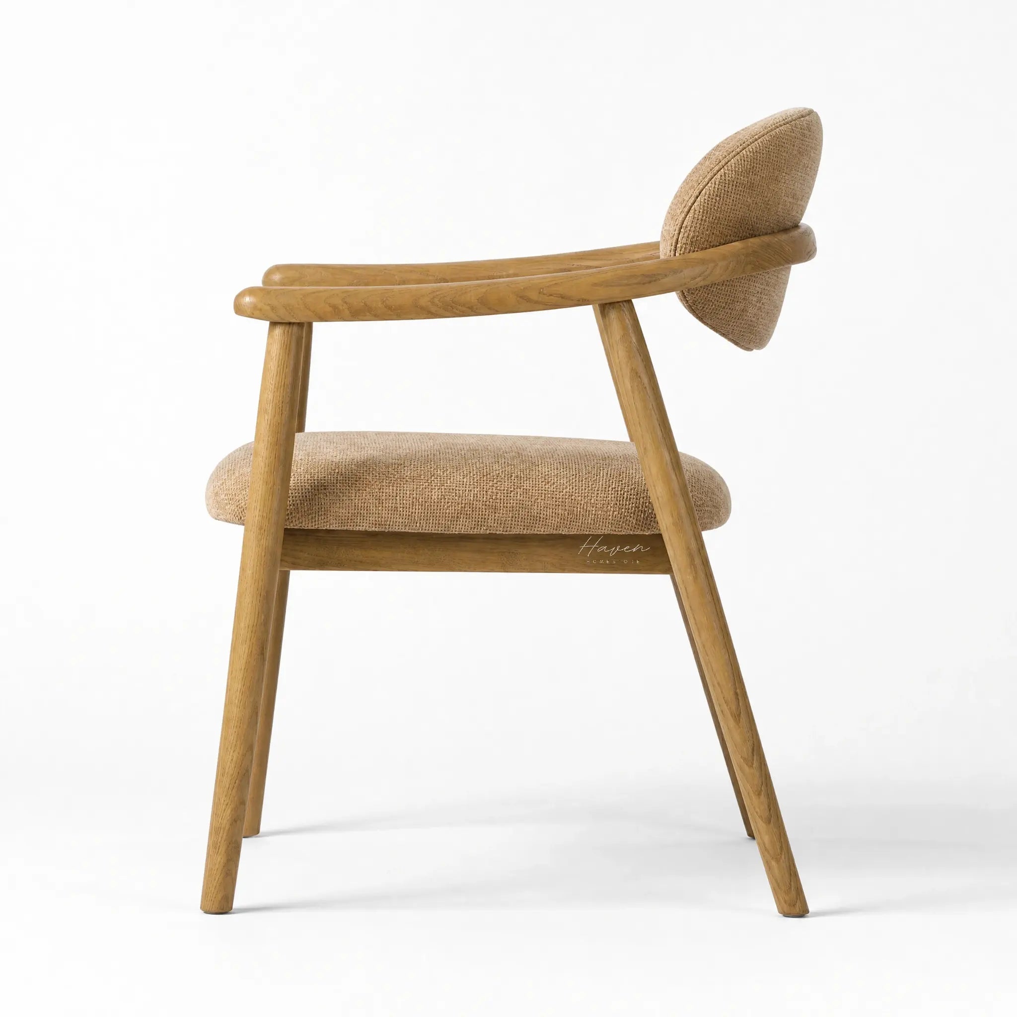 Celine Dining Chair with ash wood frame, rounded backrest, and woven beige upholstery.