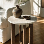 Soren Marble Side Table with round marble top and walnut-stained rubberwood base, shown with a ceramic vase.