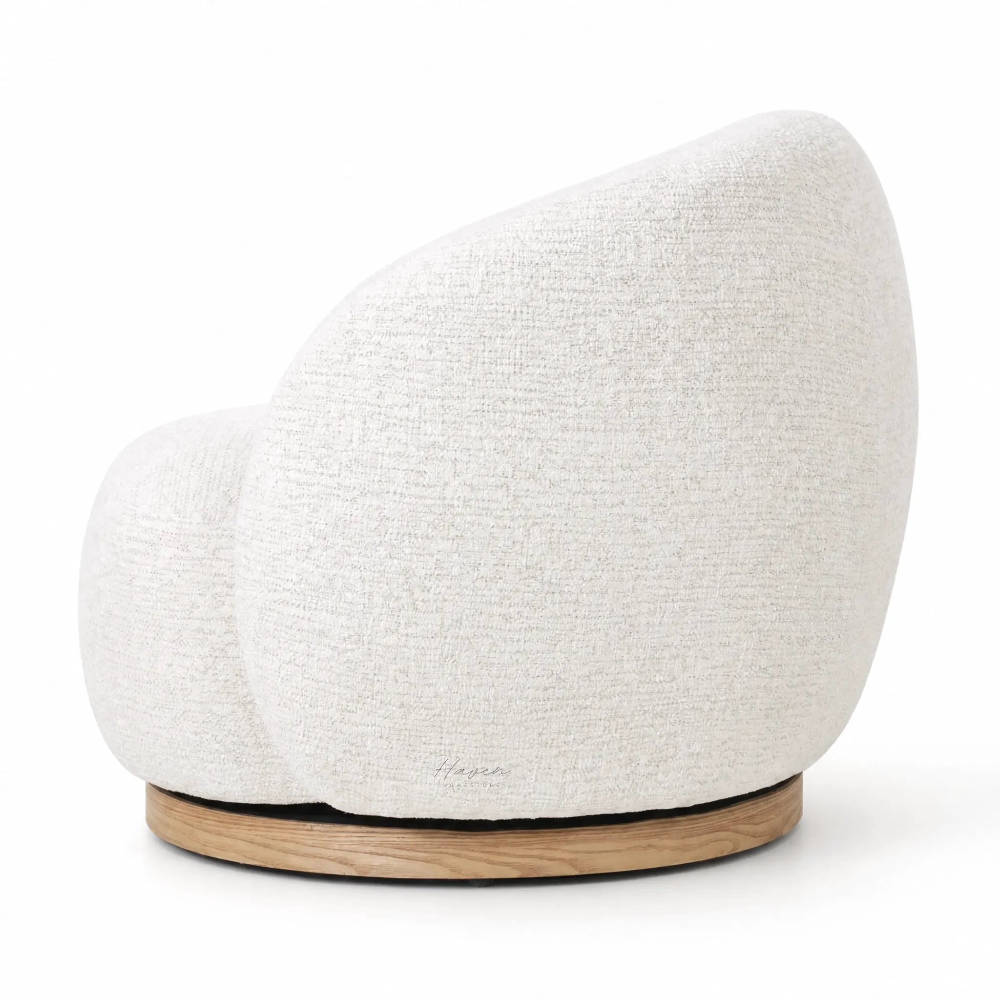 Palmetto Swivel Chair in soft textured fabric with a rounded cocoon form on a wooden base.