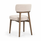 Maison Dining Chair with solid ash frame and beige polyester upholstered seat and backrest.