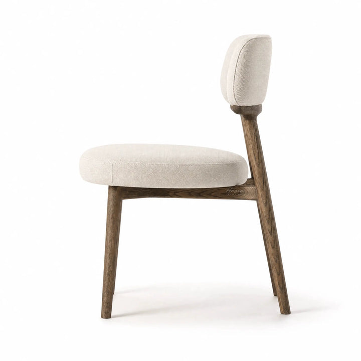 Maison Dining Chair with ash wood frame and beige polyester upholstered seat and backrest.