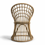 Tulum Dining Chair with curved cane frame and open woven back in natural rattan.