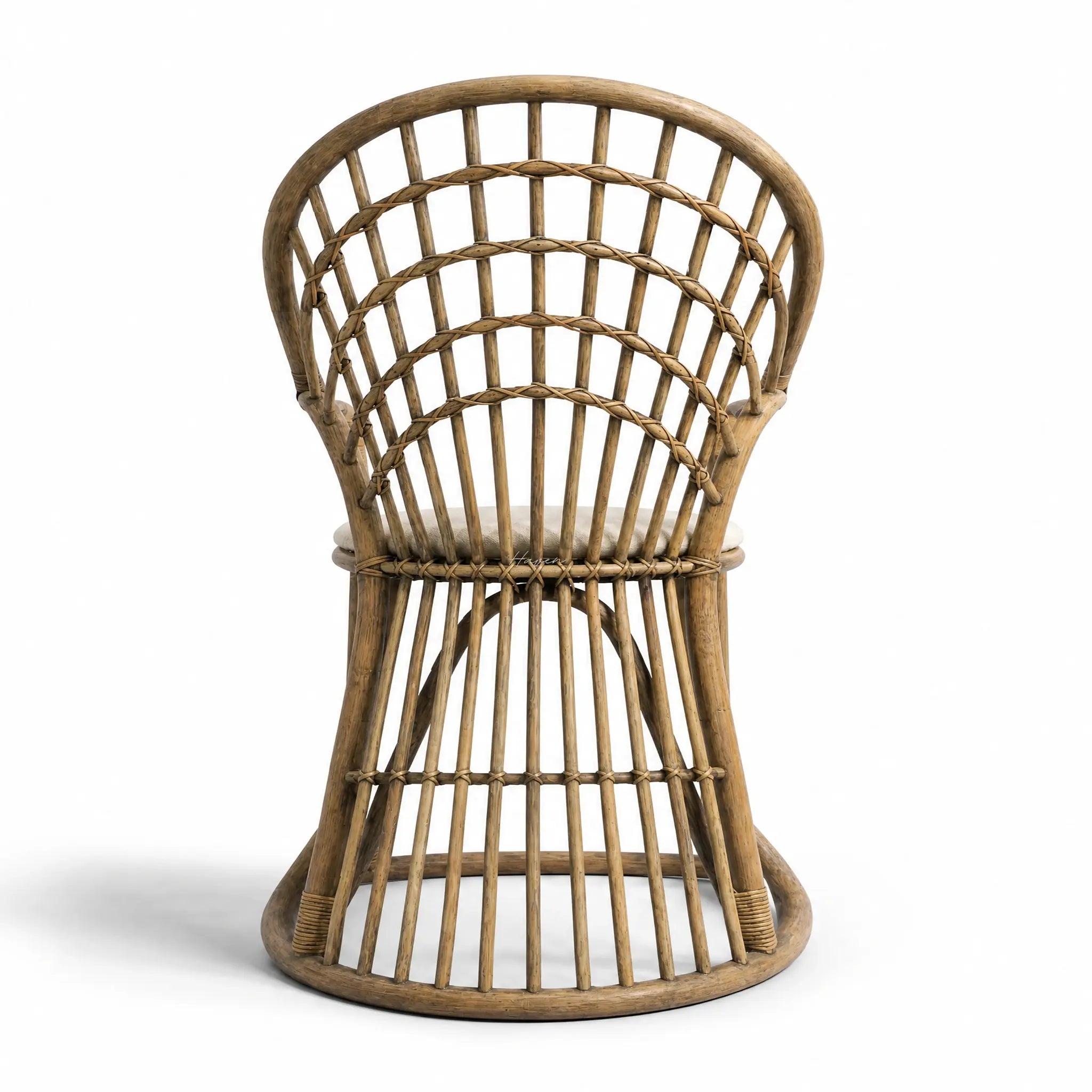 Tulum Dining Chair with curved cane frame and open woven back in natural rattan.