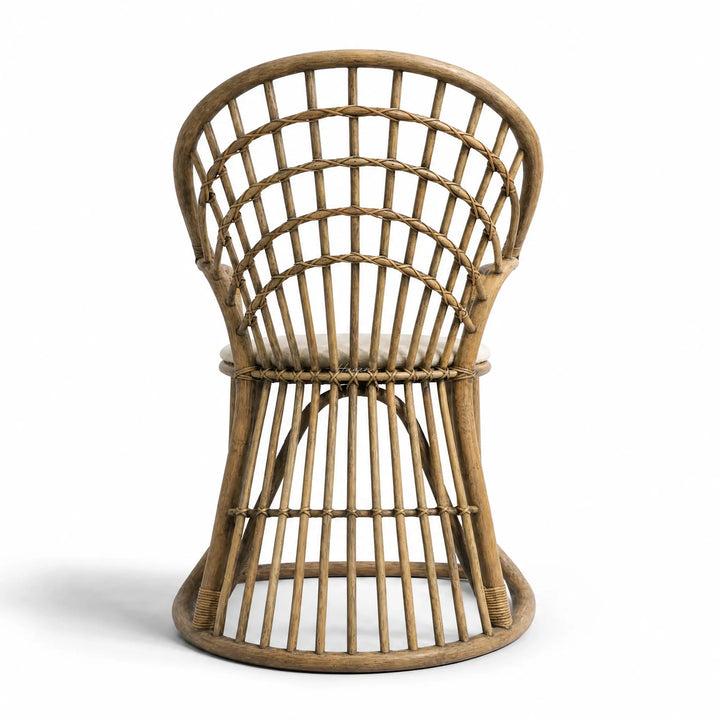 Tulum Dining Chair with curved cane frame and open woven back in natural rattan.
