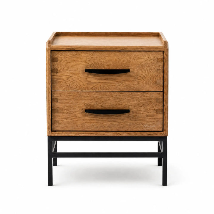 Carlton 2-Drawer Bedside Table in oak with black handles on a slim metal base.