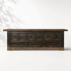 Nomad Coffer Blackened: dark reclaimed-pine cabinet with textured panels and carved details.