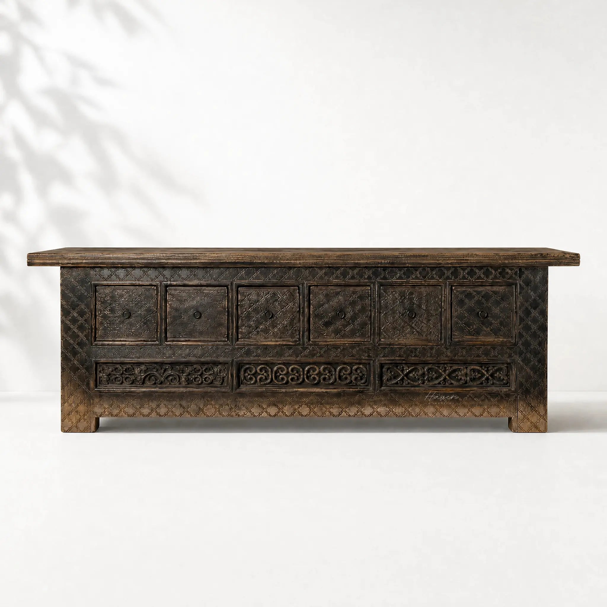 Nomad Coffer Blackened: dark reclaimed-pine cabinet with textured panels and carved details.