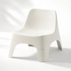 Forma Outdoor Chair in white polypropylene with sculptural curves lightweight and durable for decks patios or poolside.