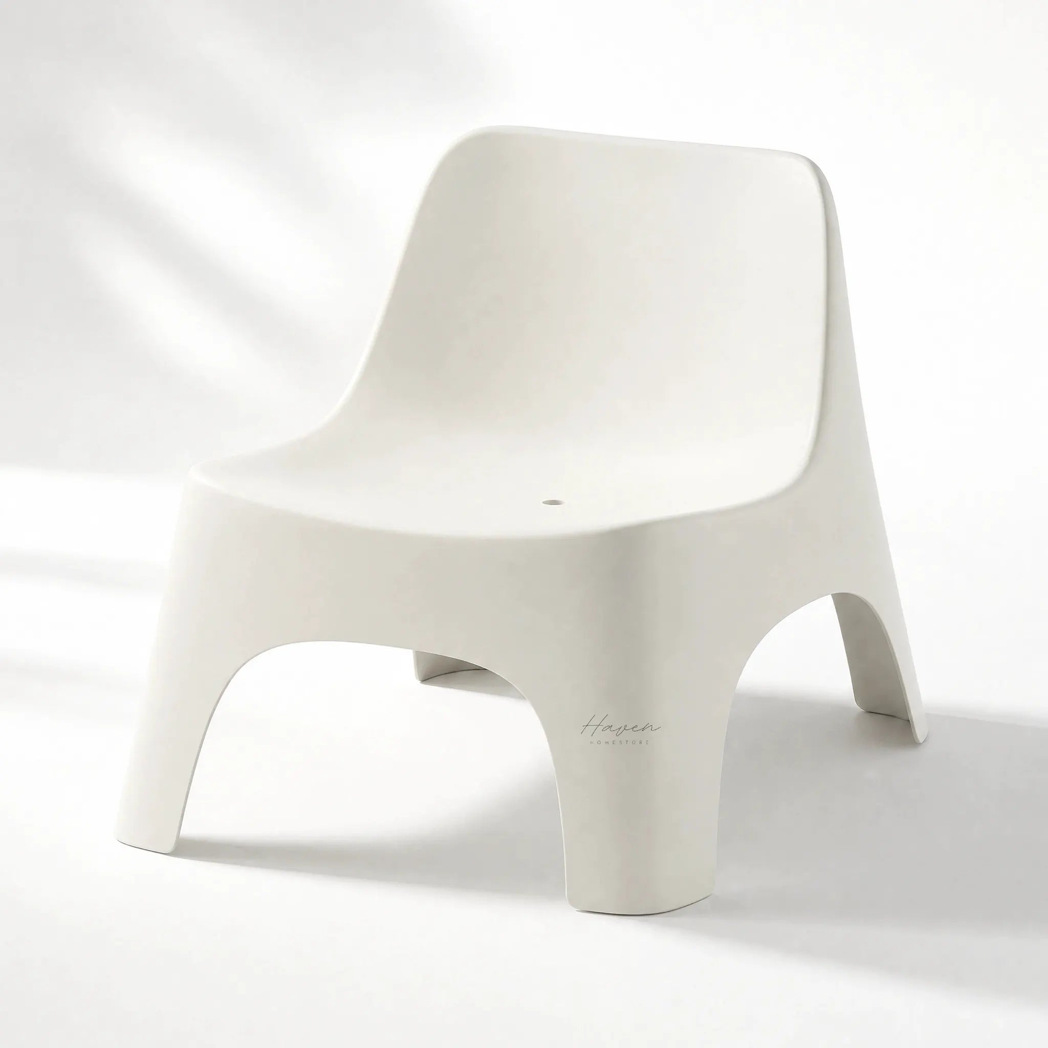 Forma Outdoor Chair in white polypropylene with sculptural curves lightweight and durable for decks patios or poolside.