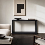 Sable Marble Console with black reclaimed pine base and marble top in a minimalist living room.