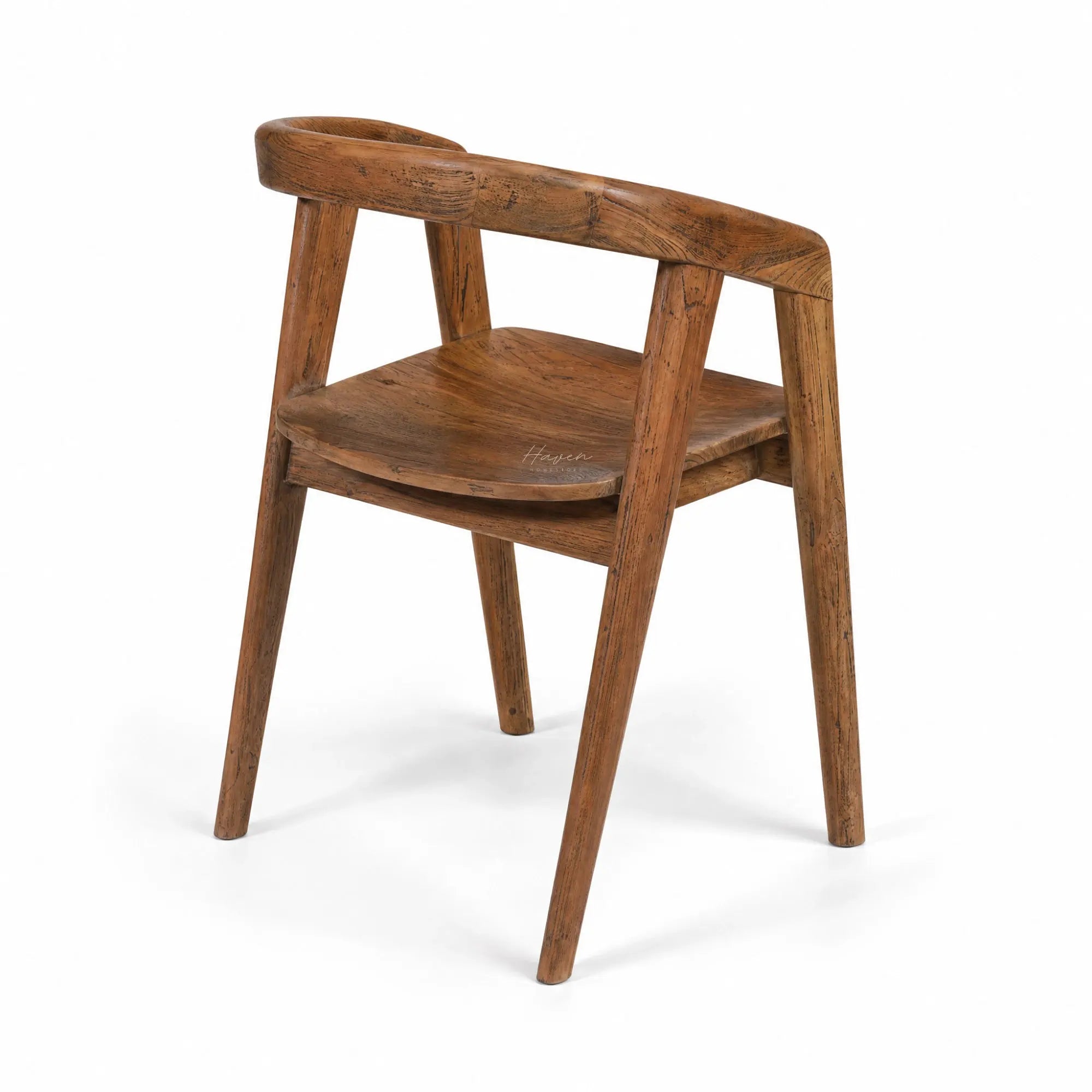 Dune Teak Dining Chair with curved arms and warm solid teak finish, sculptural organic silhouette.