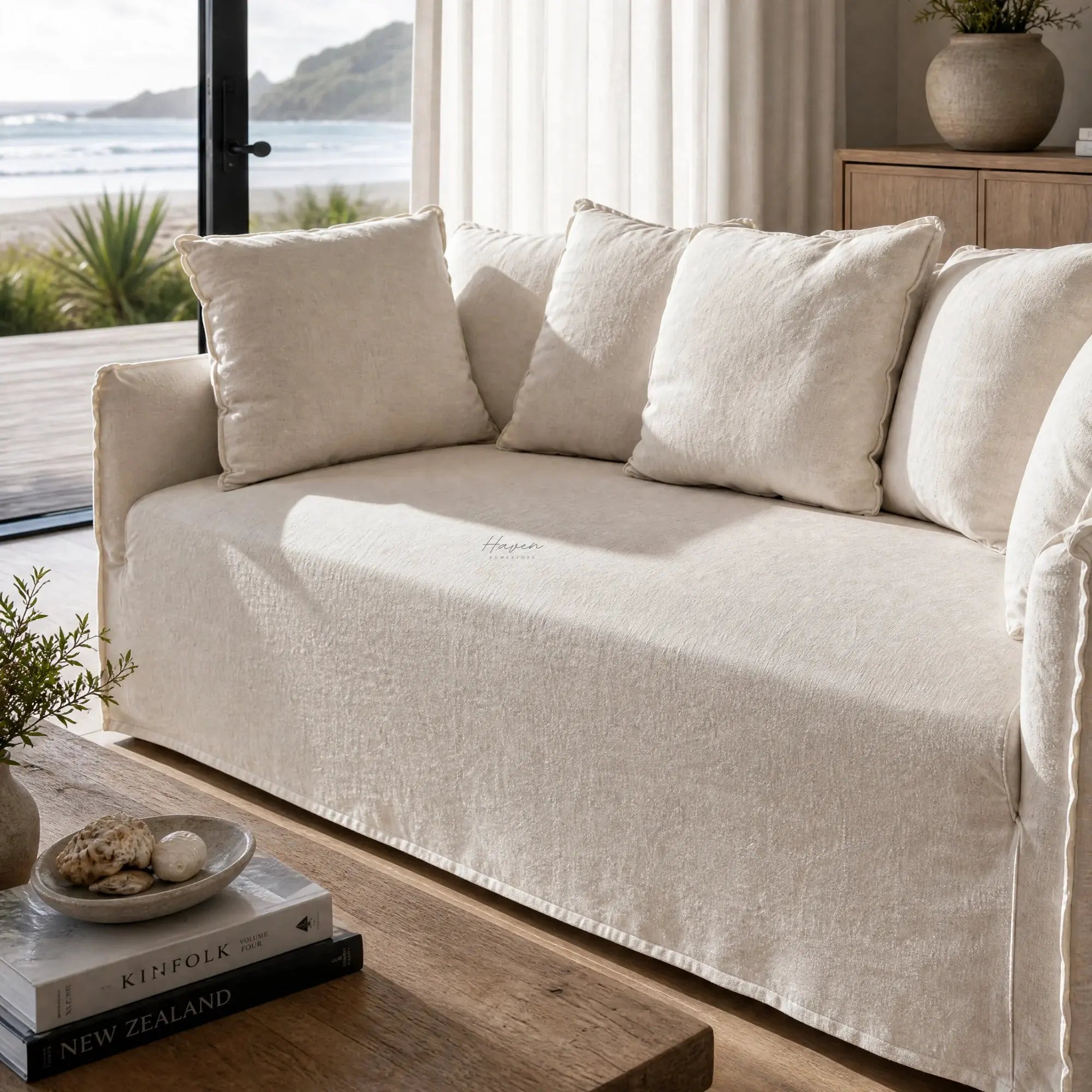 Cove Slipcover Sofa 2-seat in soft linen-cotton with plush feather and foam-filled cushions in a coastal living room