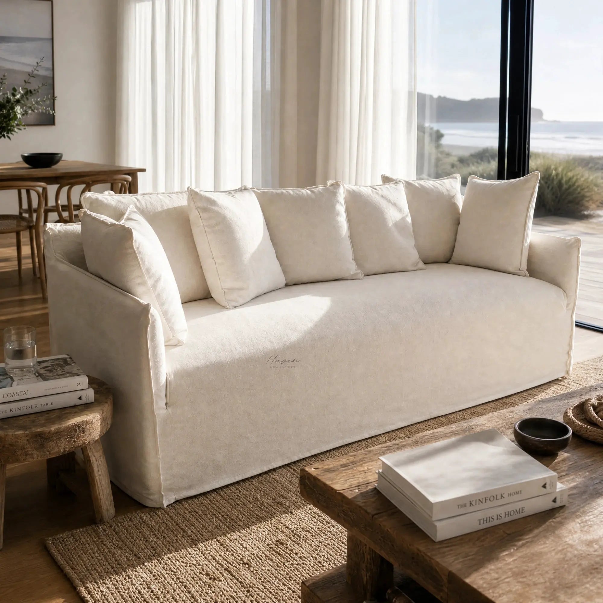 Cove Slipcover Sofa - 3 Seat in beige linen-cotton with plush cushions in a sunlit coastal living room.