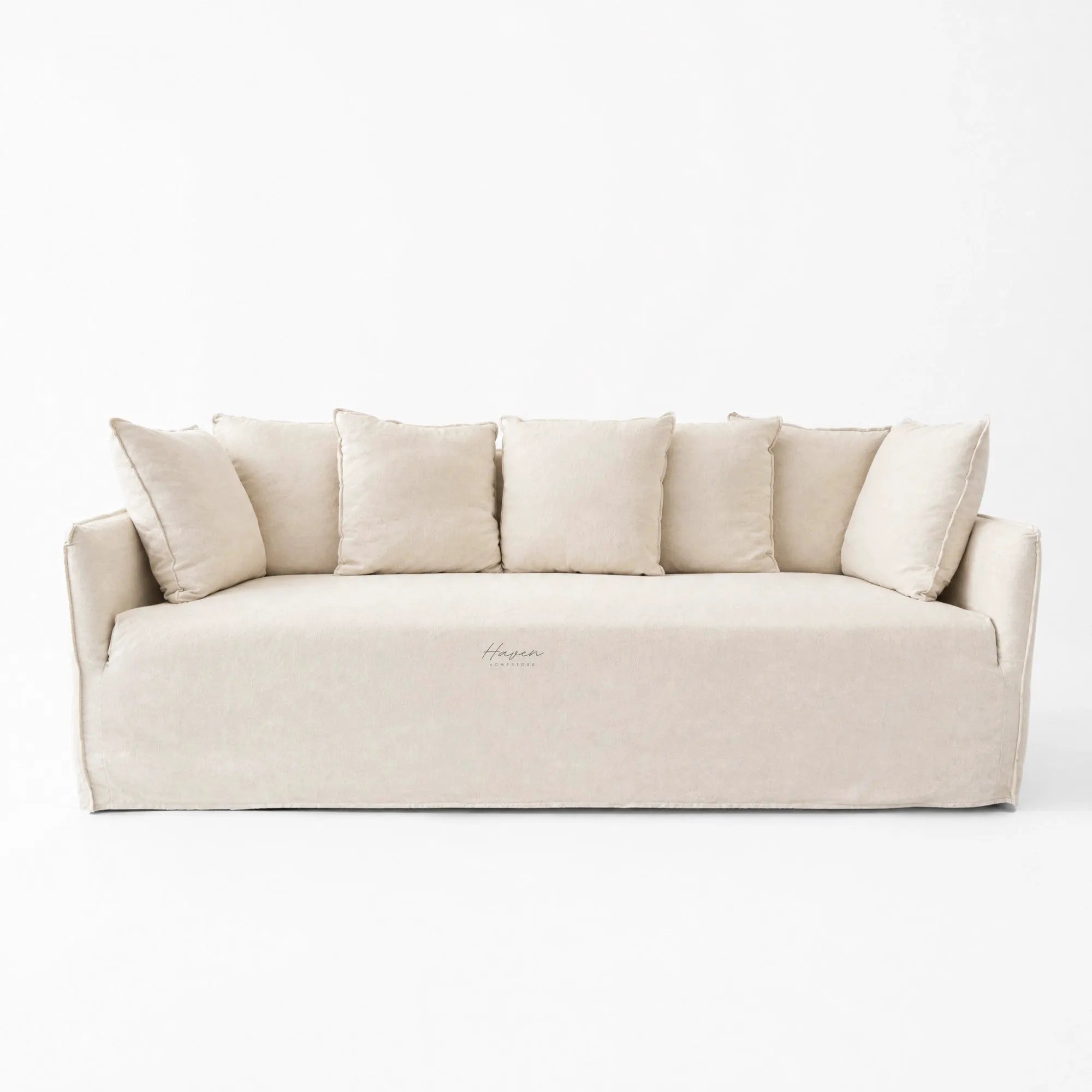 Cove Slipcover Sofa, a 3-seat beige linen-cotton blend sofa with plush cushions on a white backdrop.