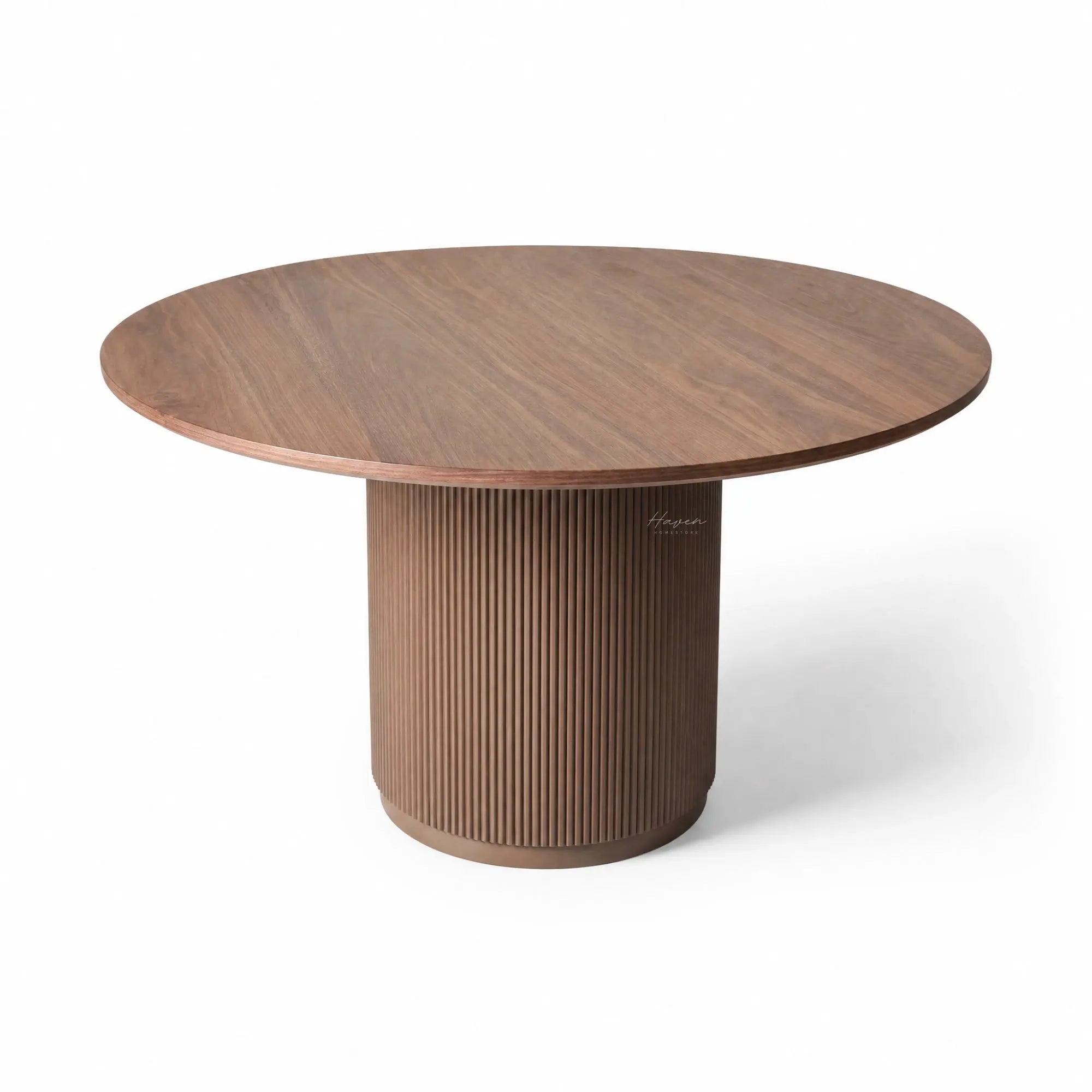 Sora Dining Table - Walnut, with a round top and fluted, ribbed pedestal base.