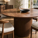Sora Dining Table - Walnut: round top with fluted pedestal base, fir wood and timber veneer.