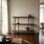 Hakari Shelves - Natural: oak shelves on a slim black iron frame in a bright, plant-filled living space.