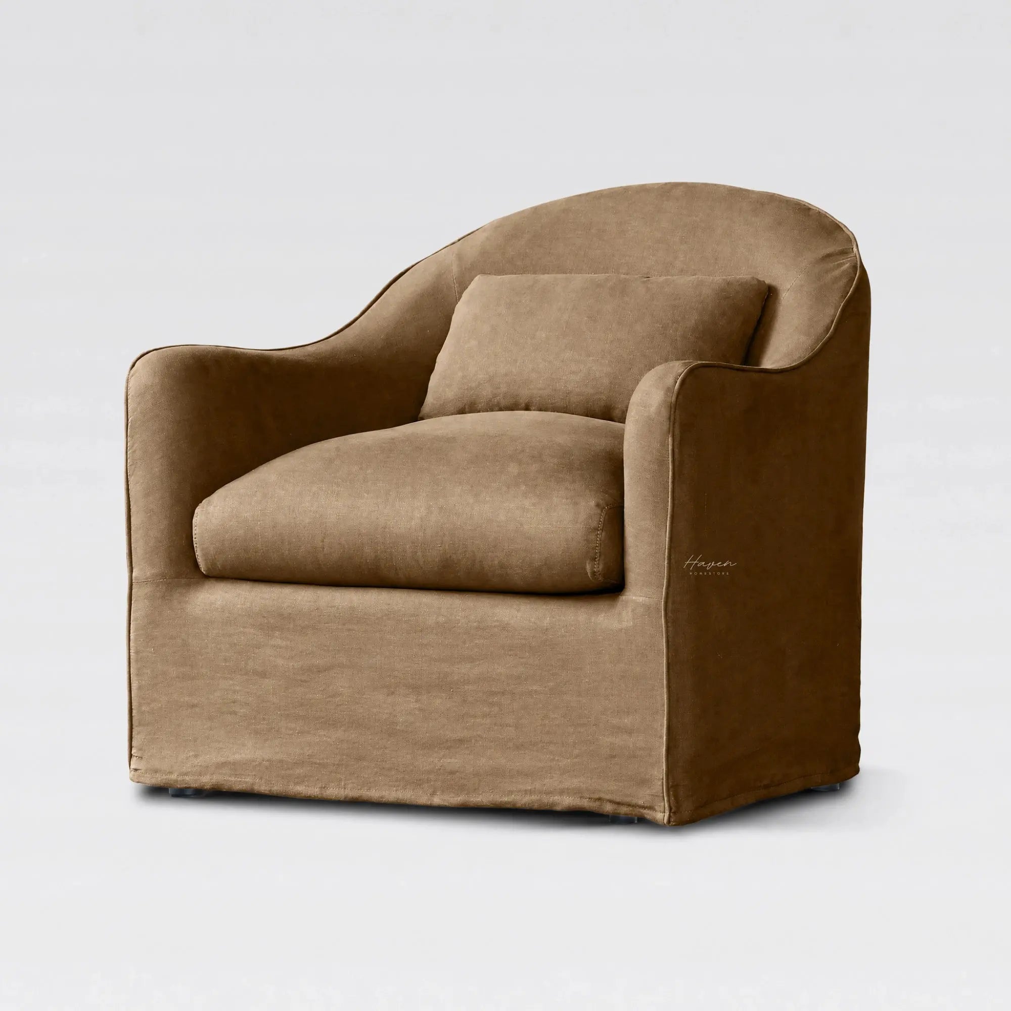 Nella slipcover chair upholstered in warm Mocha linen with a softly curved back and removable cover for a relaxed, lived-in look.