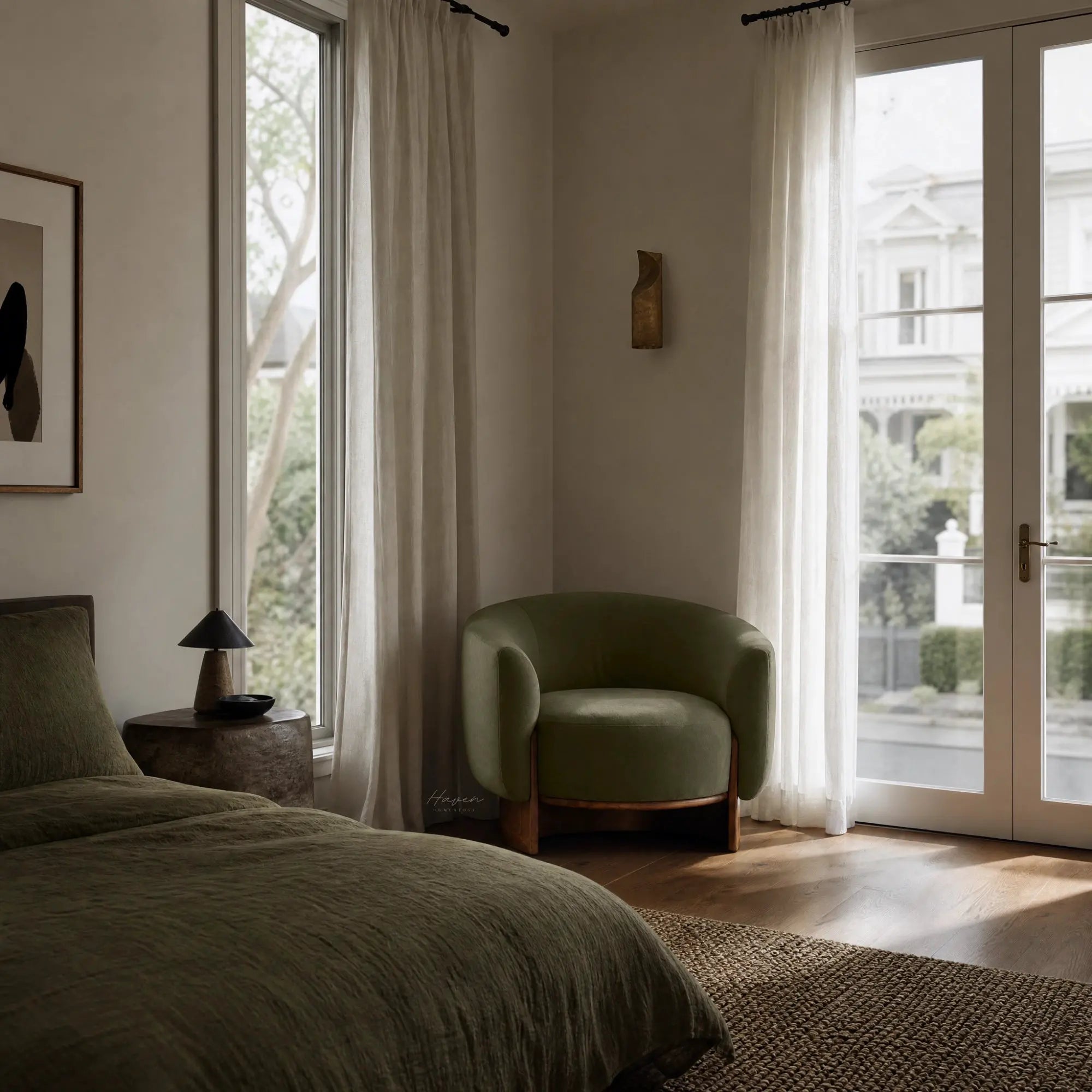 Olive mohair Aalto Chair with a barrel silhouette and curved wood base sits in a sunlit bedroom corner.