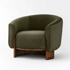 Olive mohair barrel chair with curved solid wood base, featuring soft pile upholstery and a generous silhouette.