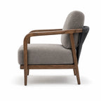 Kiso Chair featuring a deep walnut stain wooden frame, gently curved arms, and soft grey upholstered cushions.