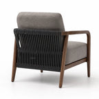 Back view of the Kiso Chair featuring a walnut wood frame, grey upholstery, and a woven rope open-frame design.