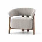 SekiChairPumice features soft upholstered form and curved backrest contrasted by a clean exposed timber ash frame structure.