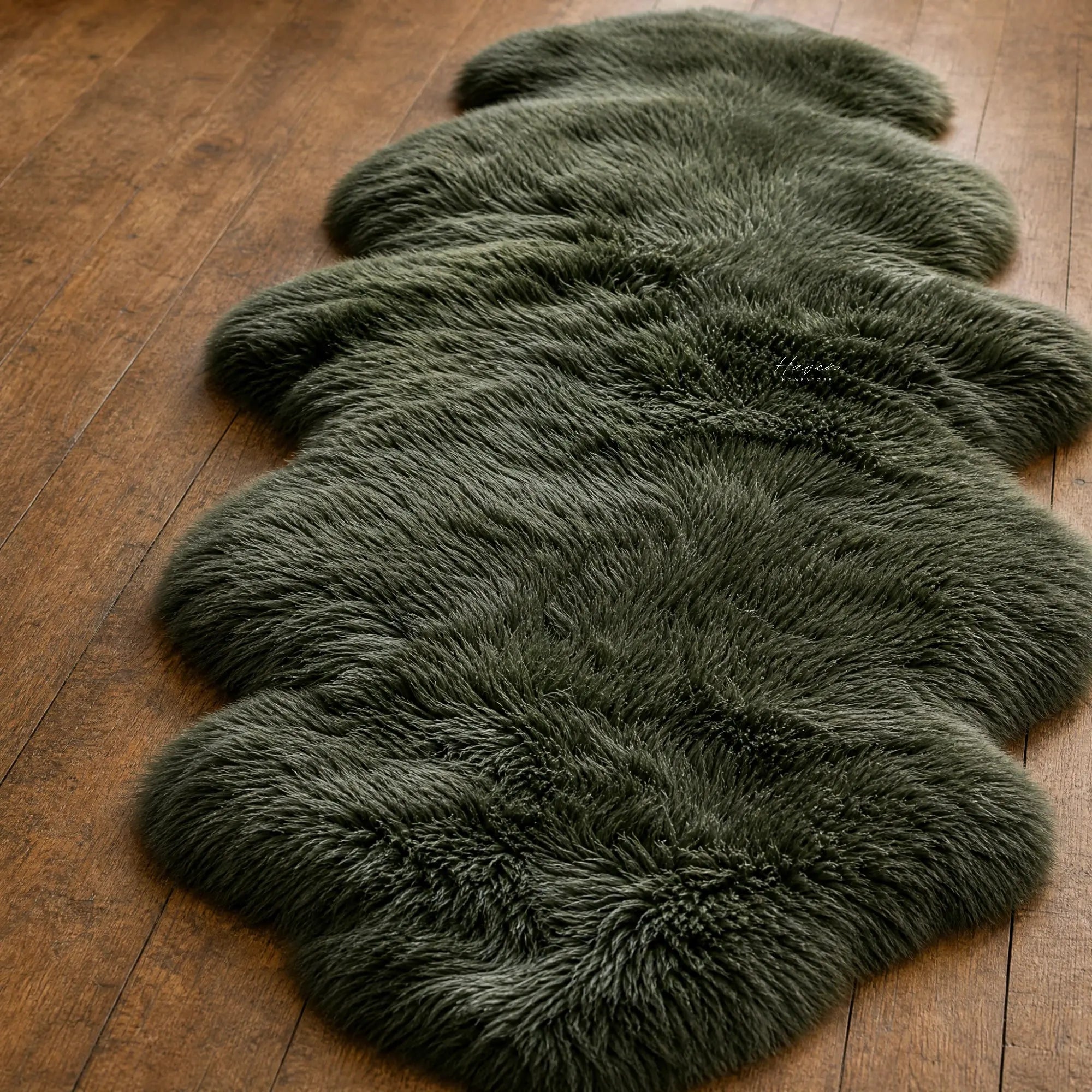 Thyme Kaikoura double sheepskin rug featuring long, fluffy wool texture laid on warm wooden floorboards for a cozy room feel.